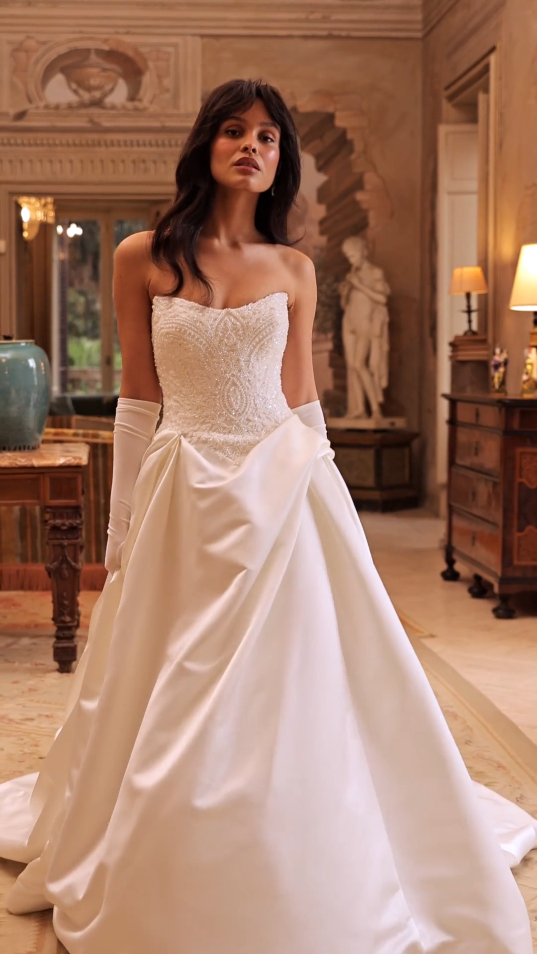 ValStefani JUNO Video of beaded appliques on satin scoop neck ball gown with pleats and chapel train