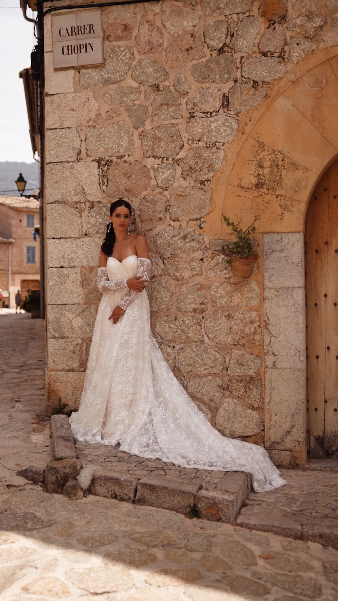 Bride Wearing Rustic Strapless Sweetheart Wedding Dress With Sparkly Florals and Detachable Long Sleeves Bride Wearing Rustic Strapless Sweetheart Wedding Dress With Sparkly Florals and Detachable Long Sleeves