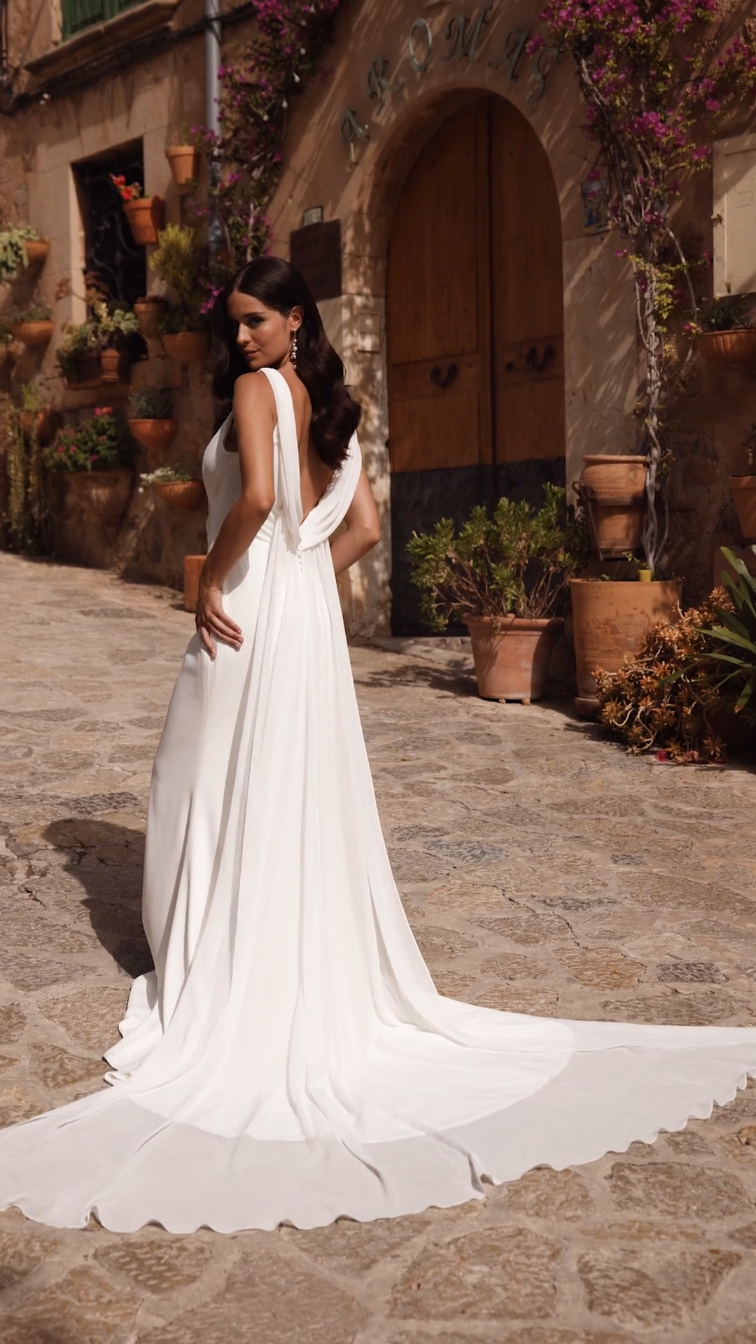 Bride Wearing Crepe Mermaid and Detachable Chiffon Train Wedding Dress Bride Wearing Crepe Mermaid and Detachable Chiffon Train Wedding Dress