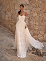 Bride wearing style Mar a sweetheart neckline A-line wedding dress with all over small florals Bride wearing style Mar a sweetheart neckline A-line wedding dress with all over small florals