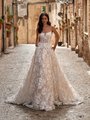 Bohemian floral lace A-line wedding dress with scoop neckline and pockets in the skirt Bohemian floral lace A-line wedding dress with scoop neckline and pockets in the skirt