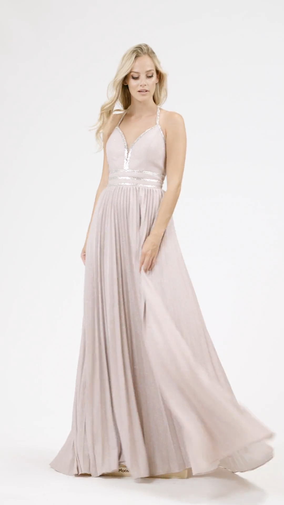 Val Stefani 3915RG sparkle jersey A-line with pleated skirt and halter neck prom dress