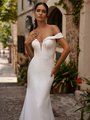 Closeup of bride wearing simple off the shoulder crepe wedding dress Closeup of bride wearing simple off the shoulder crepe wedding dress